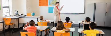 Student writing notes at a desk